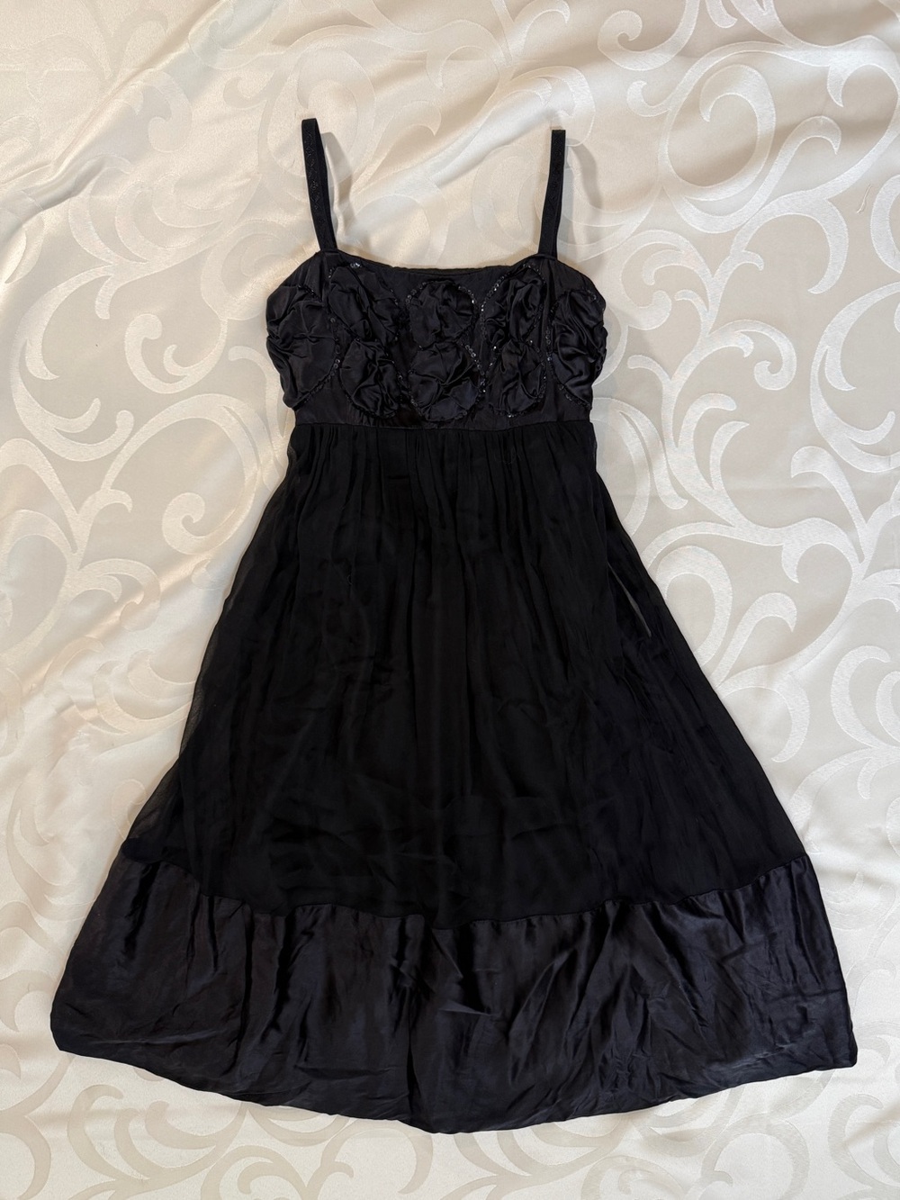 Sleeveless Black Midi Dress with Rosette Bodice